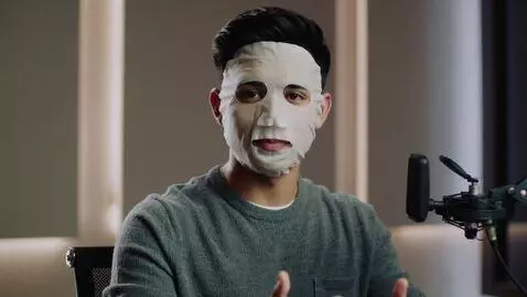 AI Video from prompt: Animate the young man sitting in the studio so t