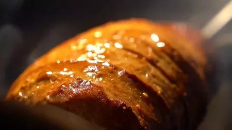 AI Video from prompt: A cinematic close-up of juicy doner meat rotatin