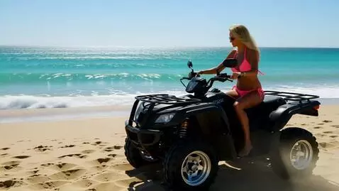 AI Video from prompt: Blonde women riding an atv in bikini