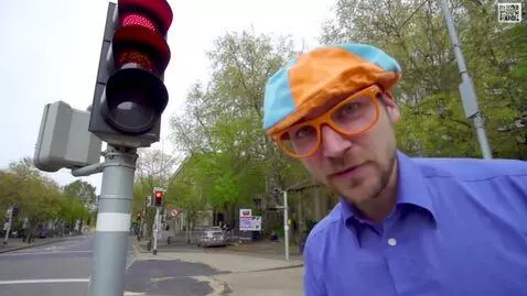 AI Video from prompt: a man standing on a city street next to a traffi