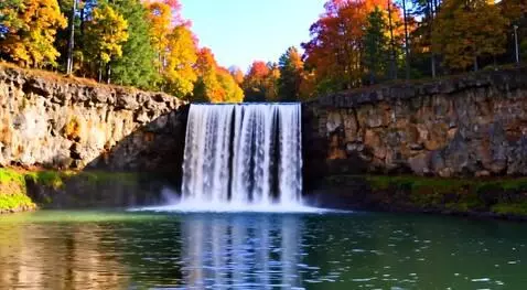 AI Video from prompt: A beautiful waterfall with tree that have fall c