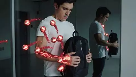 AI Video from prompt: A young man stands alone, breathing heavily, clu