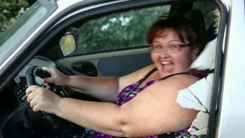 AI Video from prompt: The car begins to fall apart due to the woman's 