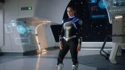 AI Video from prompt: A woman in futuristic sci-fi attire poses confid