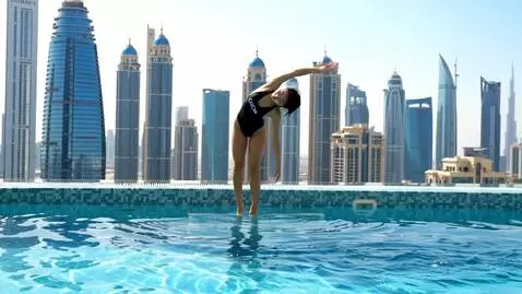 AI Video from prompt: Cinematic style. A beautiful Asian woman in a bl