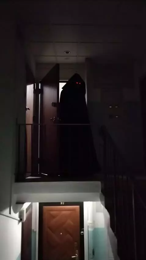 AI Video from prompt: A shadowy, ominous figure shrouded in a black, h