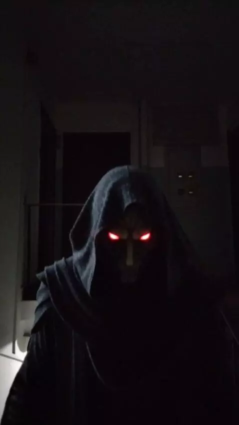 AI Video from prompt: Резко появляется в темноте. A shadowy, ominous f