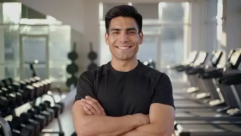 AI Video from prompt: A confident fitness coach stands in a bright mod