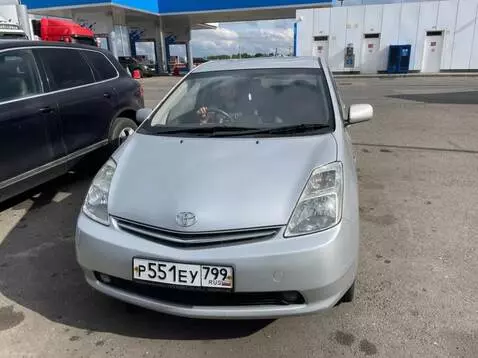 AI Video from prompt: A Toyota Prius comes to life, smiling warmly and