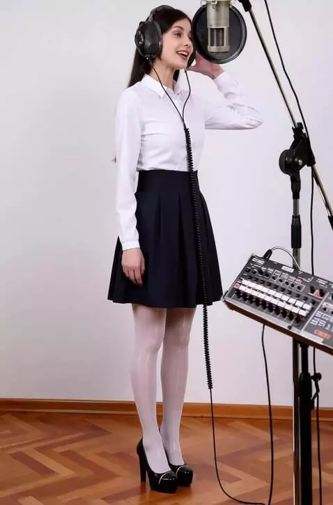 AI Video from prompt: A woman with headphones is singing. He presses t