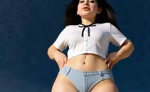 AI Video from prompt: She shows white bra and her head she talking