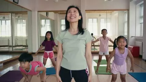 AI Video from prompt: A cheerful teacher leads a warm-up session for a