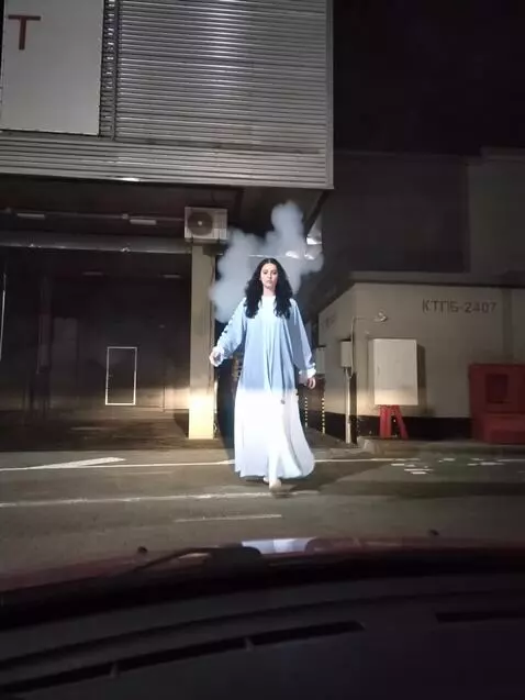 AI Video from prompt: The ghostly girl  suddenly dissolves into static