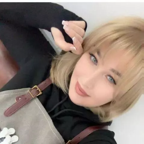 AI Video from prompt: A beautiful woman smiling gently at the camera, 