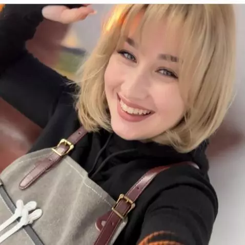 AI Video from prompt: A joyful woman with a bright smile, standing in 