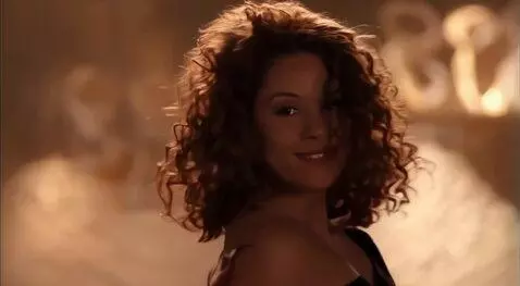 AI Video from prompt: Sexy woman in a tight black top with huge jiggly