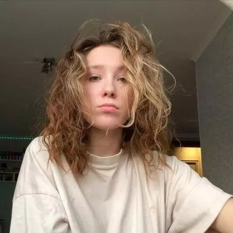 AI Video from prompt: She pulls back, raises her legs, shows her feet