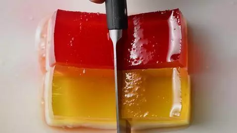 AI Video from prompt: ASMR video of cutting multi-layer jelly dessert.