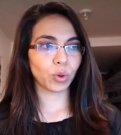 AI Video from prompt: A young woman of likely Hispanic or Middle Easte