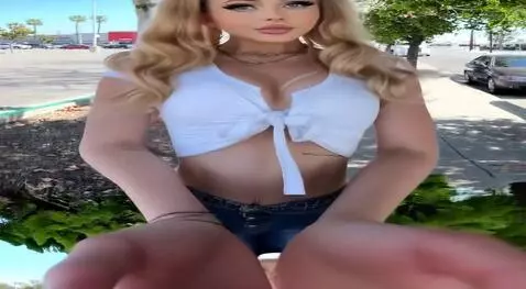 AI Video from prompt: Girl blinking, giving an air kiss and showing he