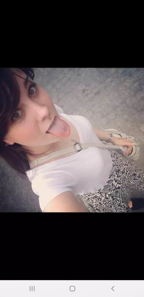 AI Video from prompt: She sticks her tongue out while lots of drool dr