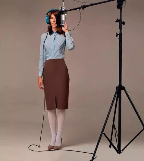 AI Video from prompt: A woman sings, presses headphones to her headю T