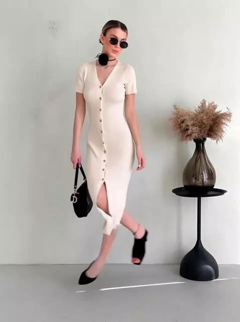 AI Video from prompt: A young woman wearing a long white dress and bla