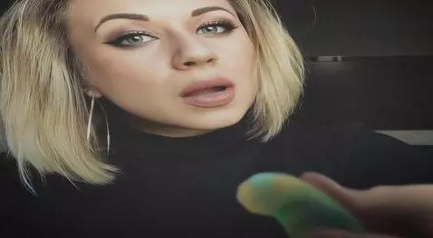 AI Video from prompt: woman swallows worlds largest gummy worm