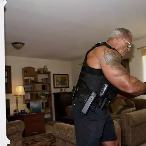 AI Video from prompt: a professional bodybuilder moves his body.