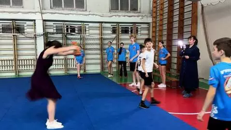 AI Video from prompt: a woman wearing a dark purple dress and holding 