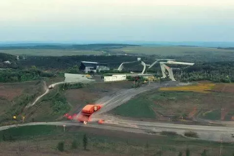 AI Video from prompt: несколько автокранов стоят в ряд. камера движетс