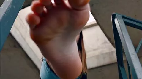 AI Video from prompt: A bottom-up view. A girl stands above, looking d