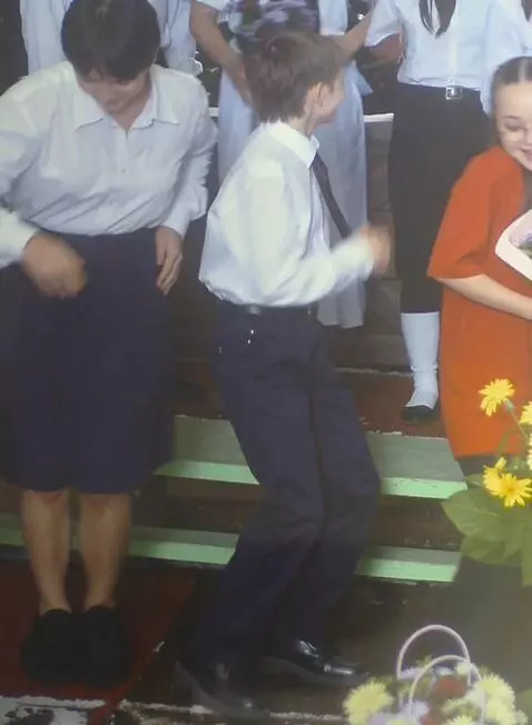 AI Video from prompt: Guy in the middle starts to dance while others r