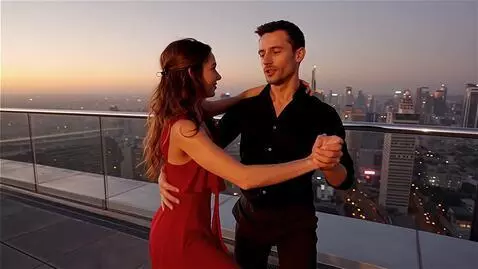 AI Video from prompt: man age 30 and a woman  age 25 dances bachata on