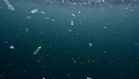 AI Video from prompt: In the dark, deep ocean, microplastics and micro