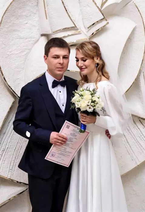 AI Video from prompt: The camera zooms in on the newlyweds, and the ma