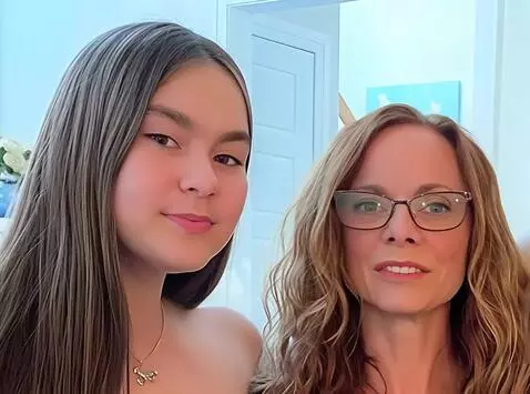 AI Video from prompt: the two people step closer toward the camera, th