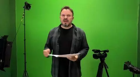 AI Video from prompt: The man says something, then his face is covered