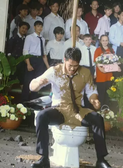 AI Video from prompt: Guy in the middle sits on toilet and wet mud sta