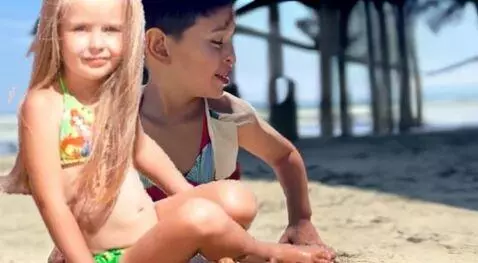 AI Video from prompt: Young couple kissing on the beach