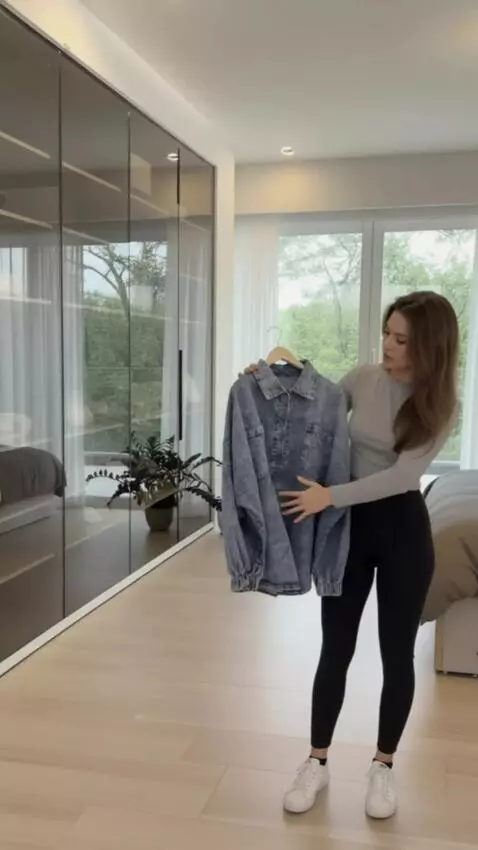 AI Video from prompt: A young woman poses gracefully like a fashion mo