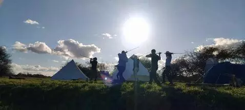 AI Video from prompt: A group practising their sword craft in unison a