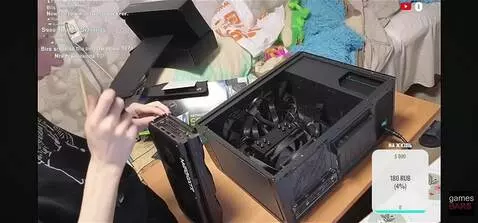 AI Video from prompt: A bald, skinny man disassembles a 5070 ti graphi
