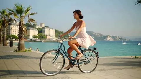 AI Video from prompt: "A beautiful young woman with dark hair styled i