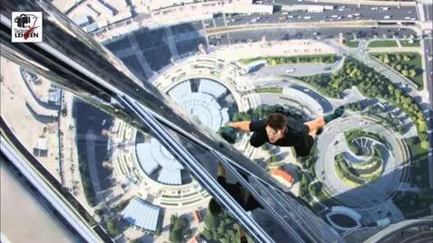 AI Video from prompt: The man falls down, but begins to quickly wave h