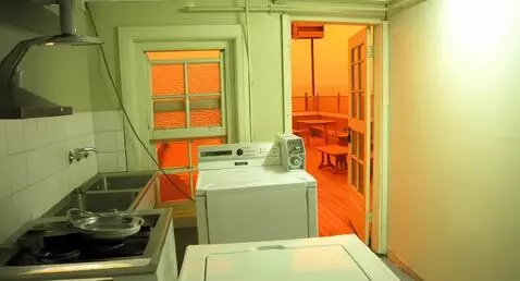 AI Video from prompt: Photo of a strange kitchen in the hallway of a b