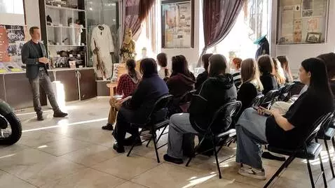 AI Video from prompt: girls sitting on chairs are trying to seduce a m