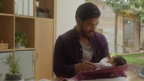 AI Video from prompt: Moslem breastfeeding baby