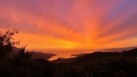 AI Video from prompt: create a beautiful sunset in a beautiful place