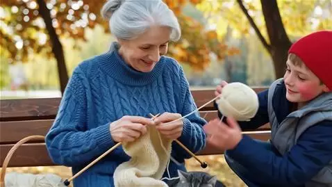 AI Video from prompt: A grandmother in a blue sweater is knitting a sc